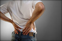 man holding his back