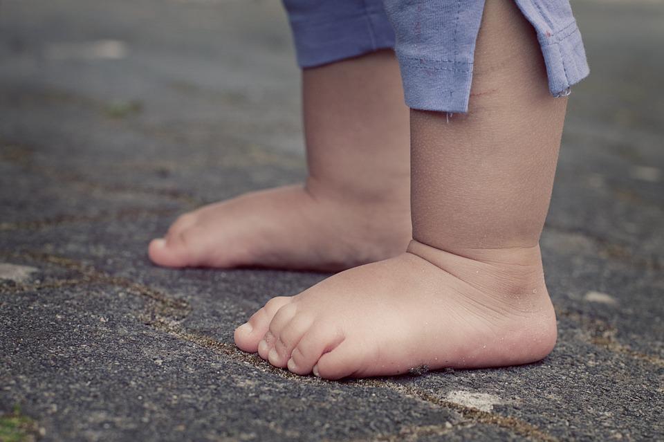 baby feet on pavement